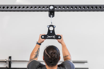 The REP Fitness Rack Crossmember Connectors with a shackle and close grip attachment installed