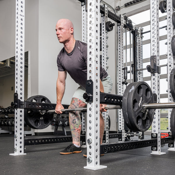 Athlete rowing with the Flip-Down Safeties 2.0 above the bar