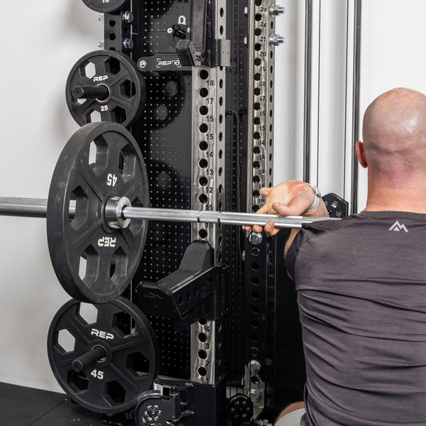 Athlete doing front squat with the short Spotter Arms 2.0 as safeties