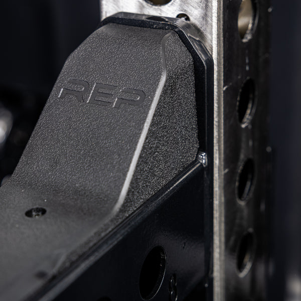 Close-up of the branding on the REP Fitness Spotter Arms 2.0