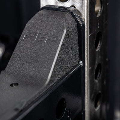 Close-up of the branding on the REP Fitness Spotter Arms 2.0