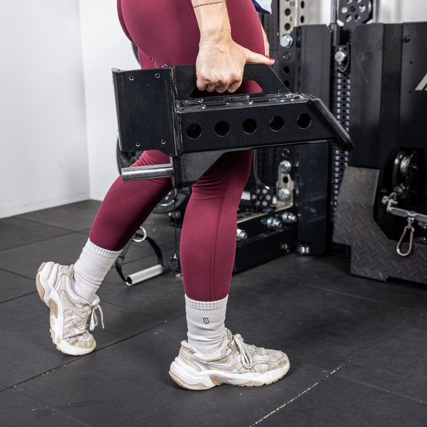 Athlete carrying a short Spotter Arm 2.0 with one hand