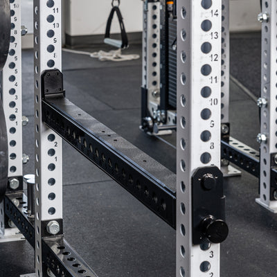 Close-up shot of the REP Fitness Flip-Down Safeties 2.0 installed on a PR-5000 rack