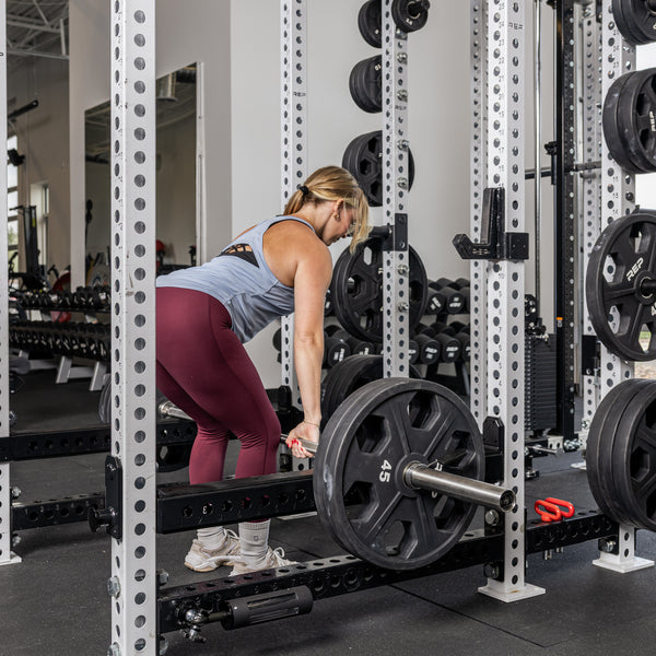 Athlete rowing with the Flip-Down Safeties 2.0 below the bar