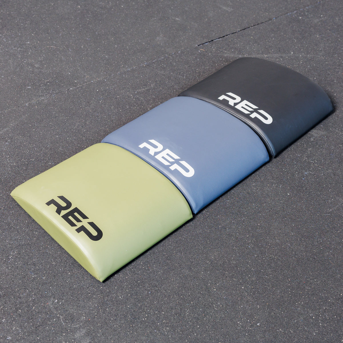 The REP Fitness Ab Support Mat 2.0 in three colors