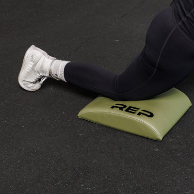The REP Fitness Ab Support Mat 2.0 to support knee.