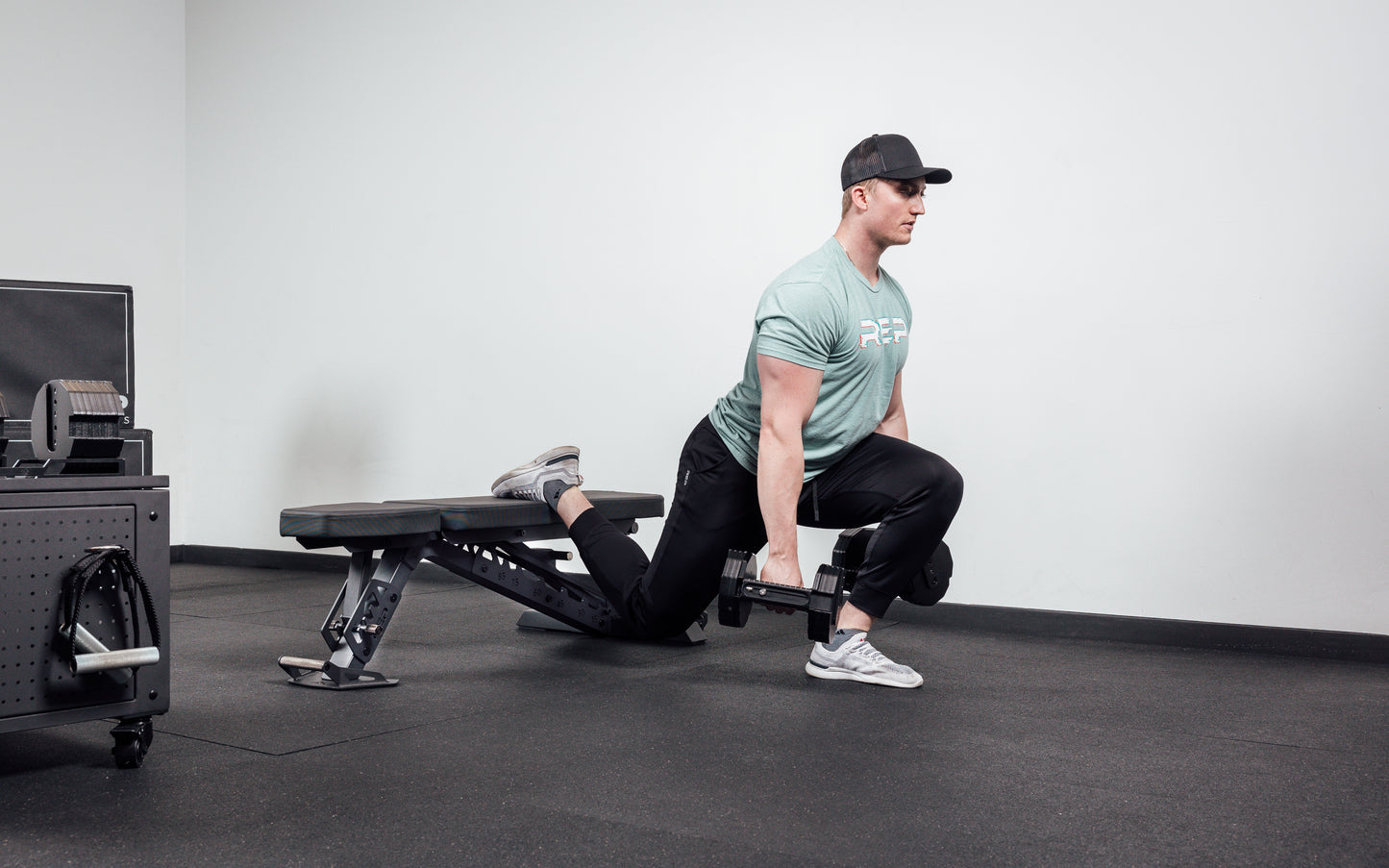 Joe doing bulgarian split squats on bench