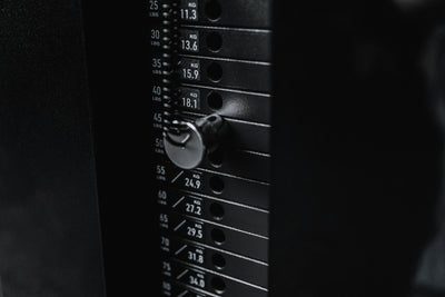 Close-up shot of one of the weight stacks and magnetized pin for the Arcadia™ max