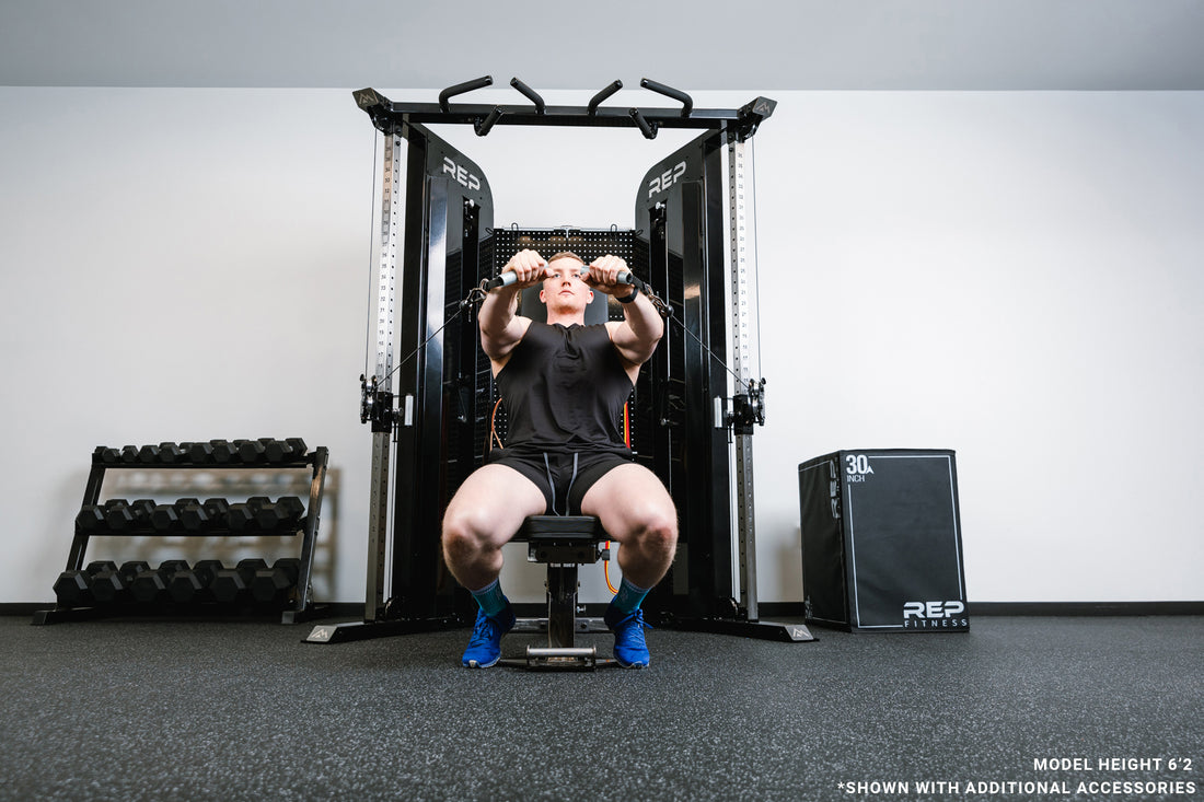 Image of someone on a bench in front of the black Arcadia™ max doing a seated chest press