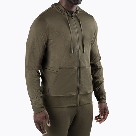 A man wearing the Attis Jacket in Heather Olive