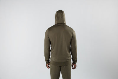 A man wearing the Attis Jacket in 
Heather Olive