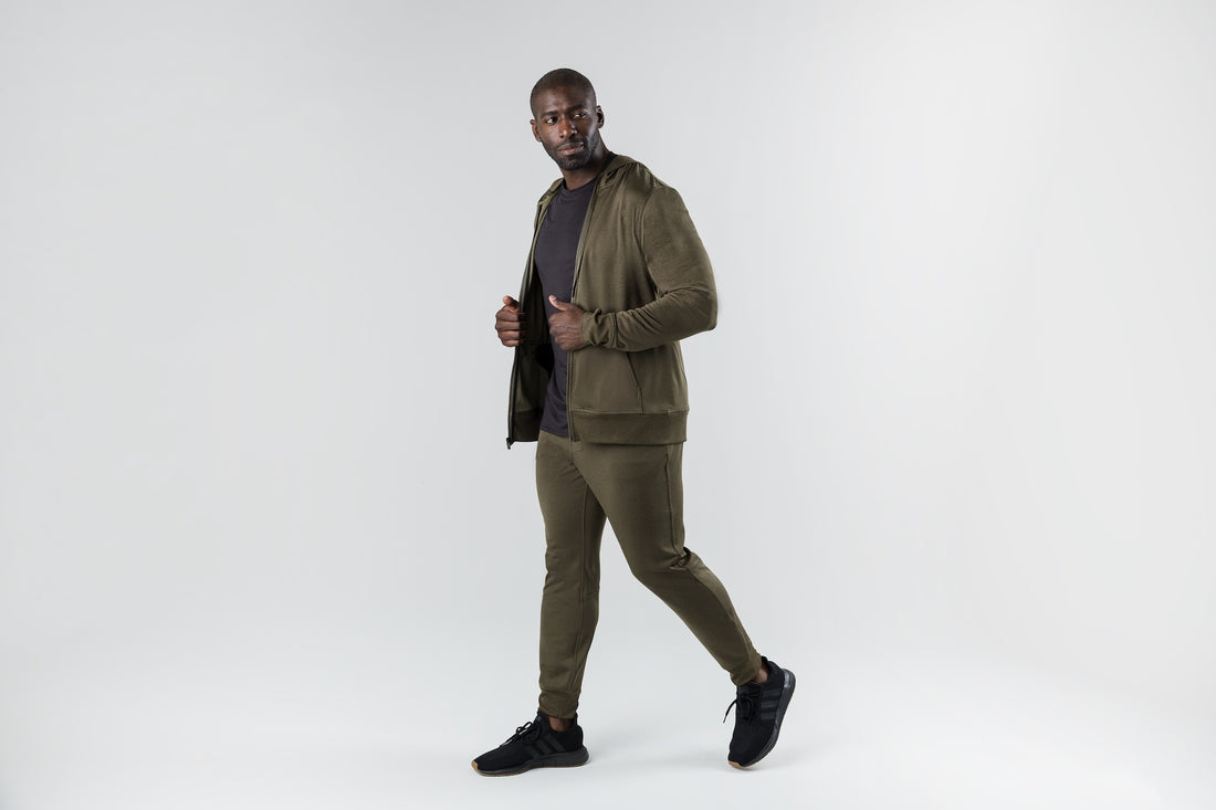 The REP Fitness Men's Attis Jacket in Heather Olive front, walking, jacket open