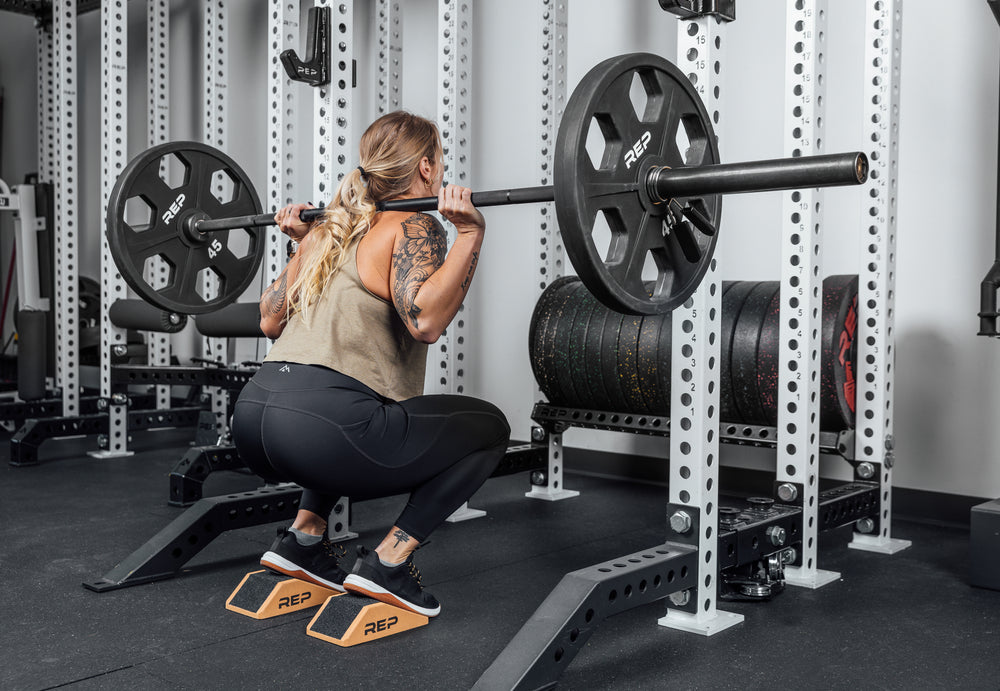 Athlete squatting using Cork Squat Wedges