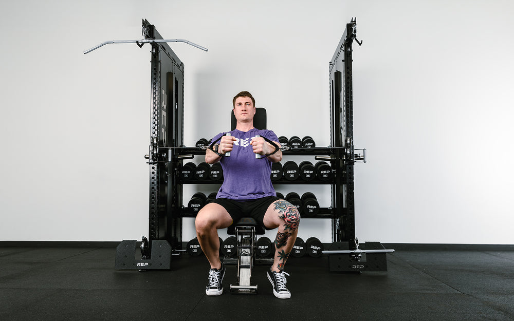 Man doing cable flys on the Dual Adonis™ with Storage setup.