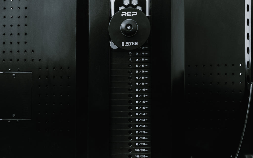 Adonis™ Cable Tower. Close up of selectorized weight stack and additional weight on the weight horns