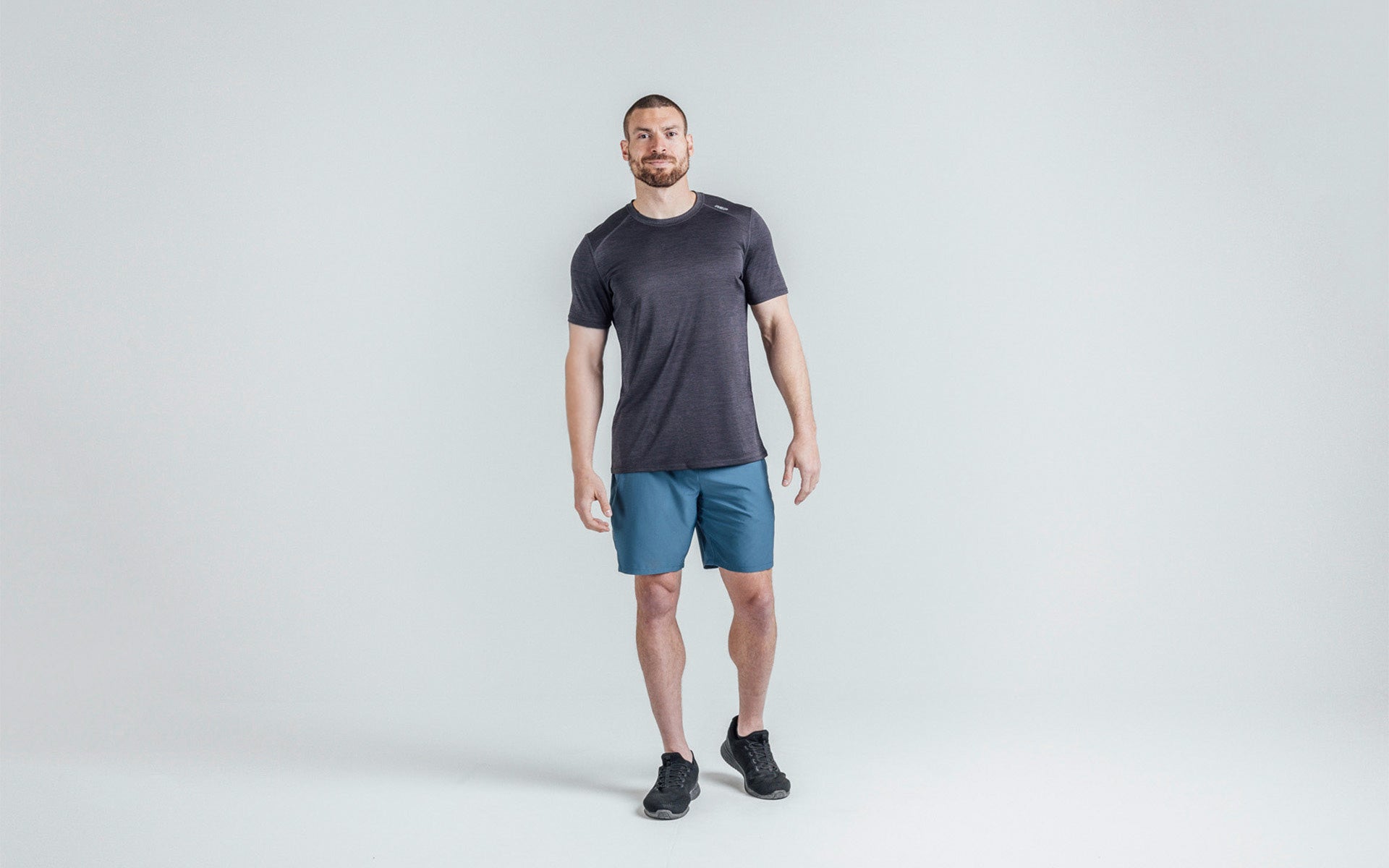 Athlete wearing Heather Black Sigmatech Shirt