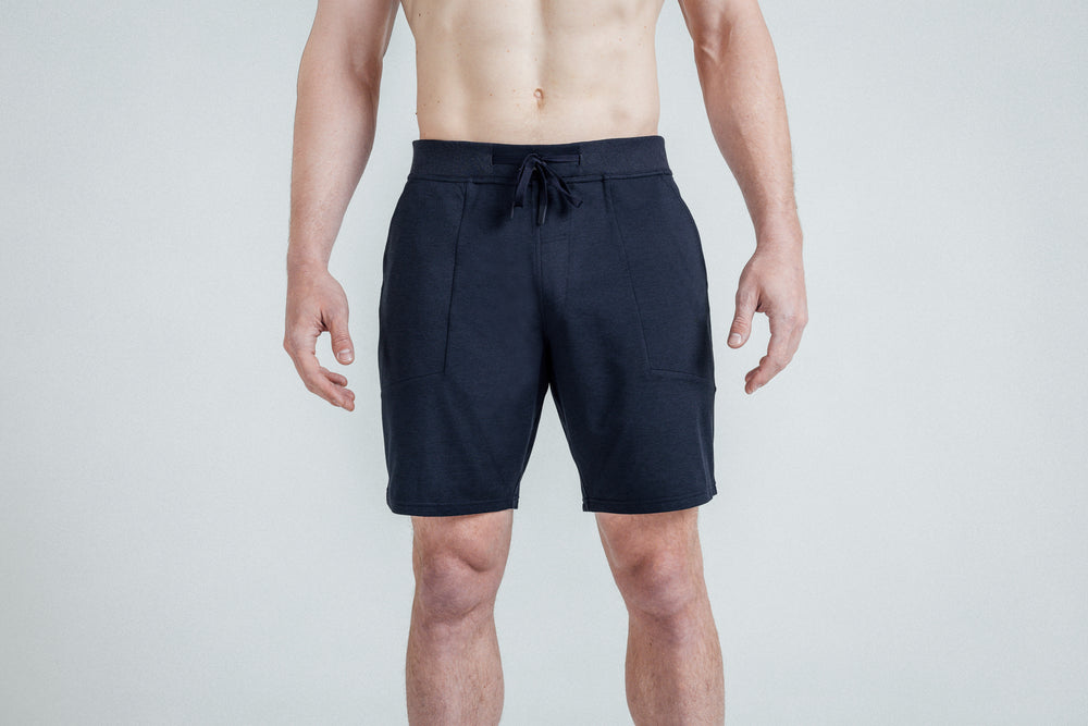 Front view of the REP Men’s Apollo Shorts with a 9 inch inseam in Heather Navy/Cool Gray on an athlete