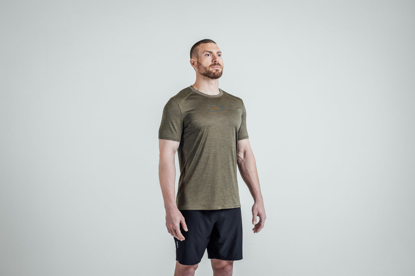 Athlete wearing Heather Olive Sigmatech Shirt
