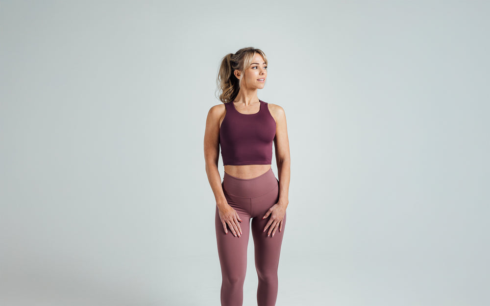 Front shot of an athlete wearing the REP Rhea Tank in Wine.