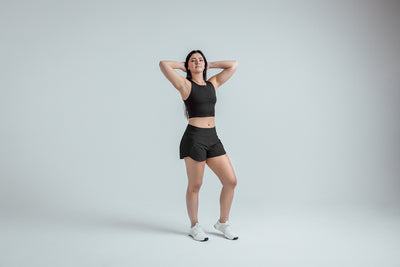 Full body shot: Athlete striking a pose in the Black Women’s Artemis Shorts