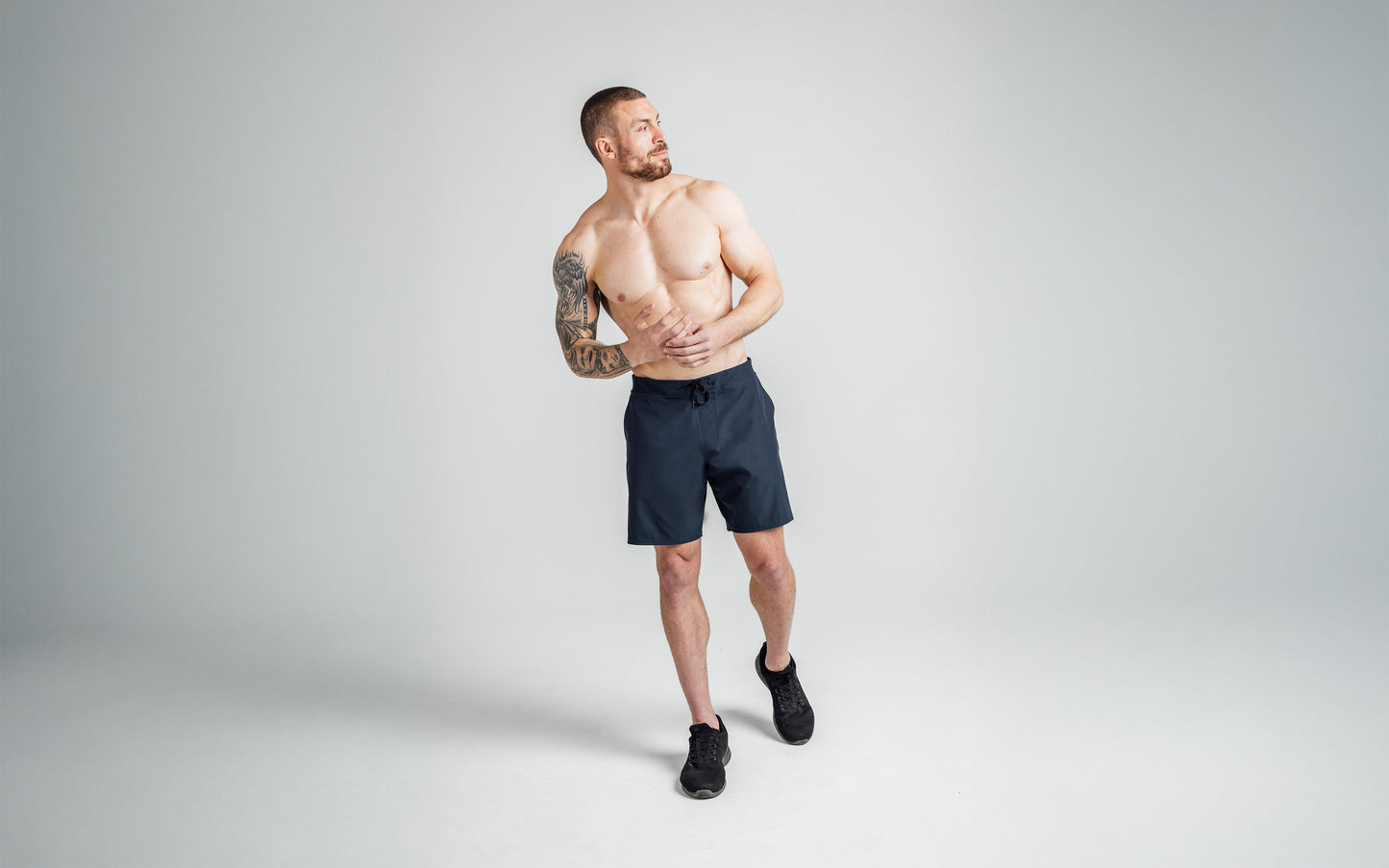 A full-body front view shot of the front of REP’s Men’s Pinnacle Shorts in Navy with a 9 inch inseam.