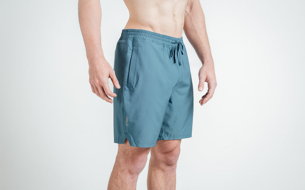 Athlete wearing slate Men's Motus Shorts