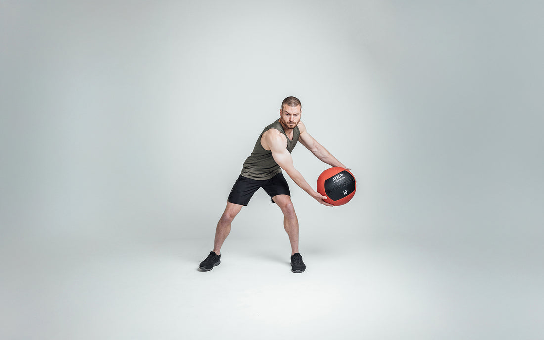 The REP Fitness Men's Motus Shorts in Black front, med ball