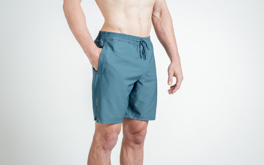 Athlete wearing slate Men's Motus Shorts