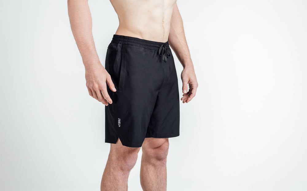 Athlete wearing black Men's Motus Shorts