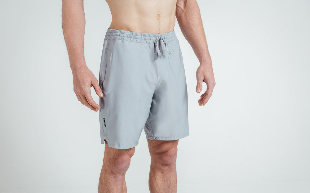Athlete wearing silver Men's Motus Shorts