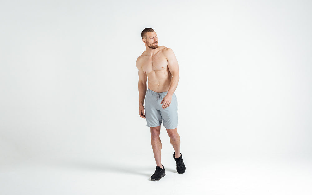 Athlete wearing silver Men's Motus Shorts