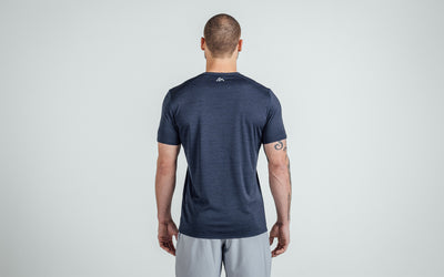 Back view of an athlete wearing Heather Navy Sigmatech Shirt