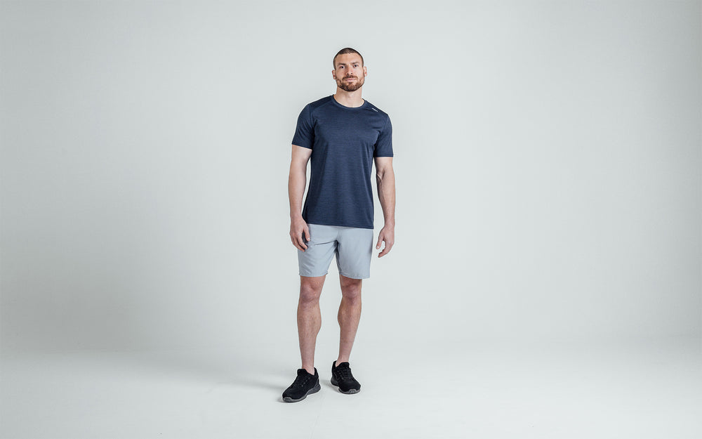 Athlete wearing silver Men's Motus Shorts