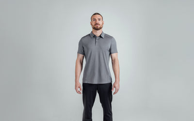 A front shot of an athlete wearing the REP Audax Polo in 
Heather Cool Gray