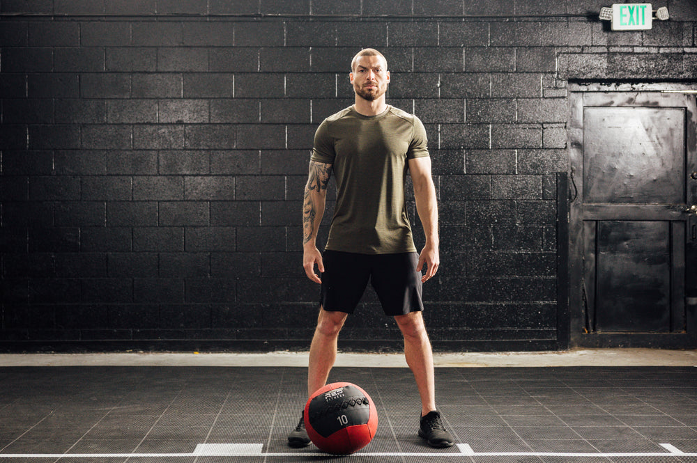 Athlete wearing black Men's Motus Shorts