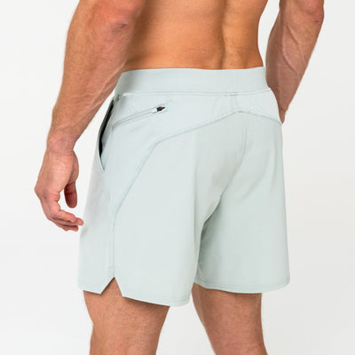 Back view of model wearing REP Pinnacle Shorts in Aqua Gray.