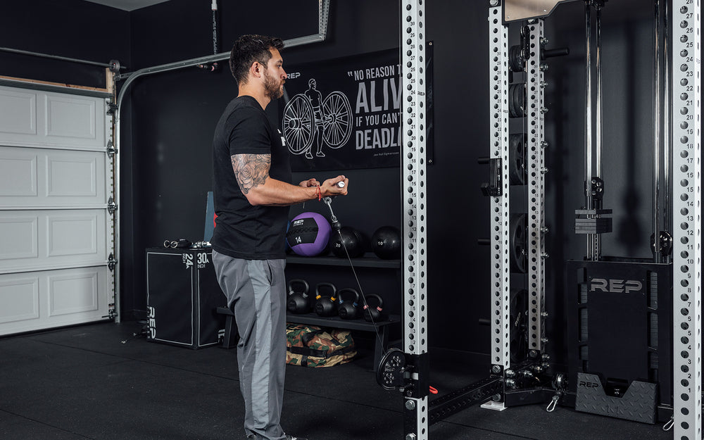 Ares Cable Attachment Being Used With The Straight Bar For Bicep Curls