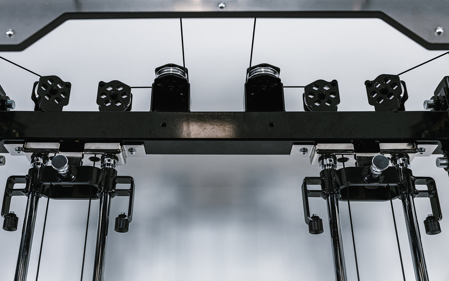 Photo showing the cable routing above dual weight stacks for the Ares 2.0