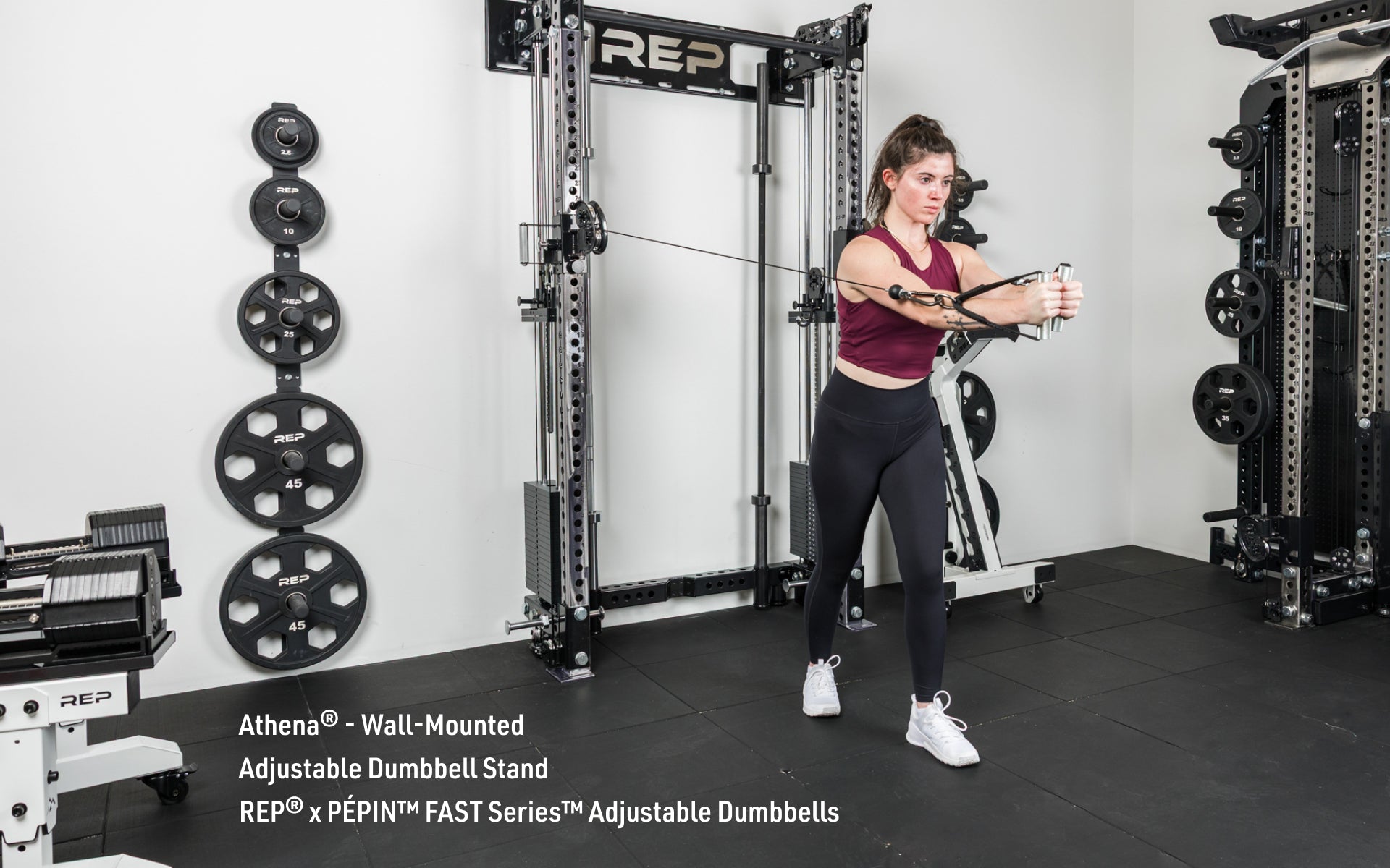 An athlete doing a cable fly exercise on the Wall-Mounted Athena rack