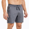 Front view of model wearing the heather cool gray REP Attis Shorts.