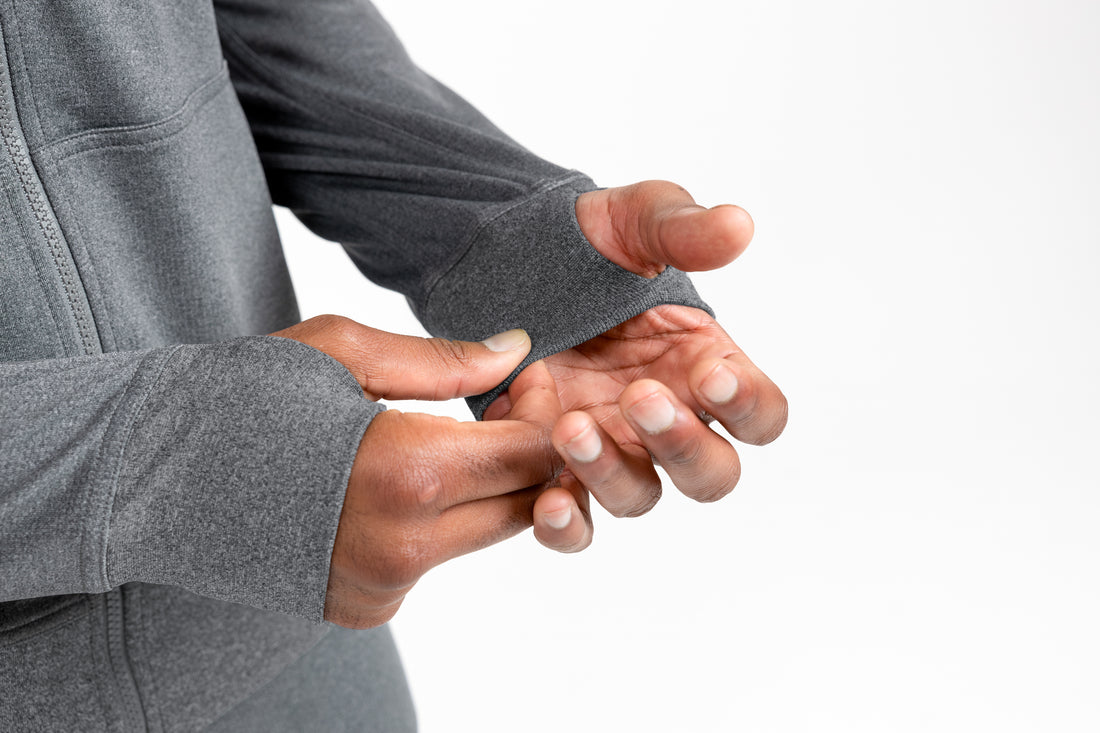 The REP Fitness Men's Attis Jacket in Heather Cool Gray front, sleeve thumbhole detail