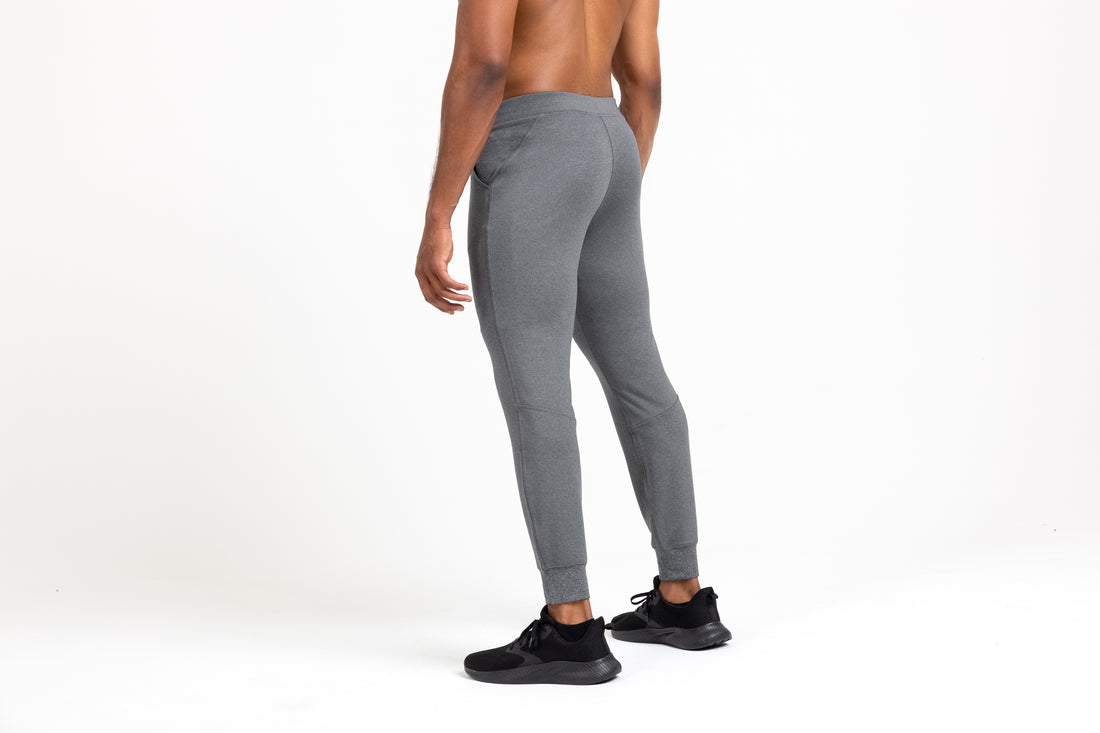 The REP Fitness Men's Attis Joggers in Heather Cool Gray back, angled view