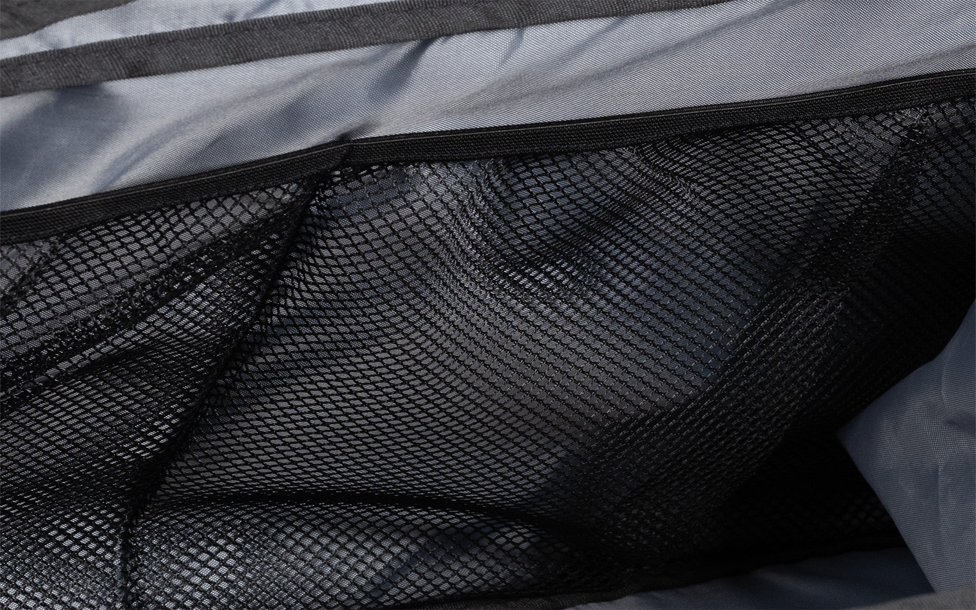 Close up of mesh pockets on the inside of the Gym Bag