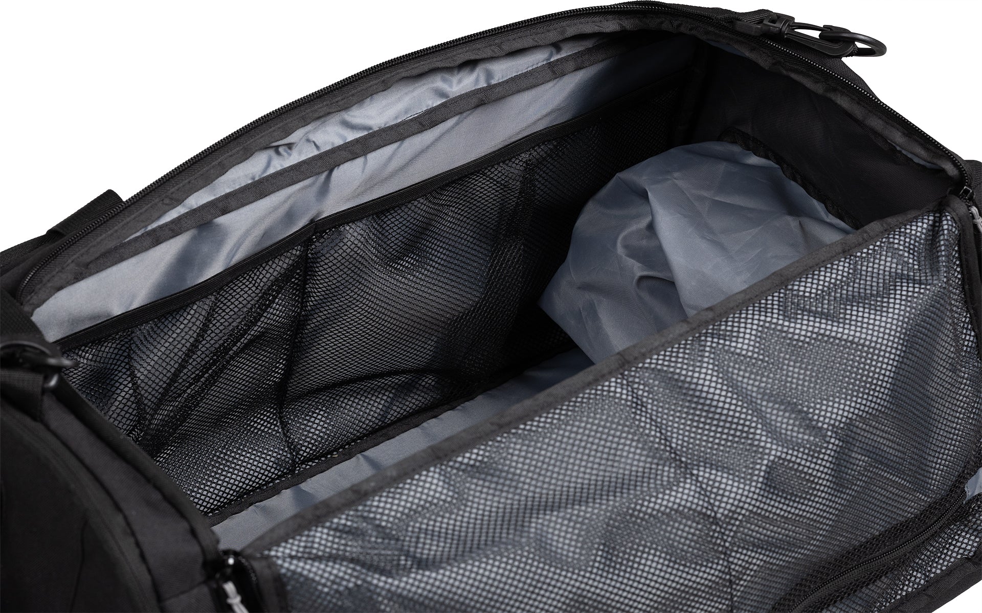 View of different mesh compartments on the inside of the Gym Bag