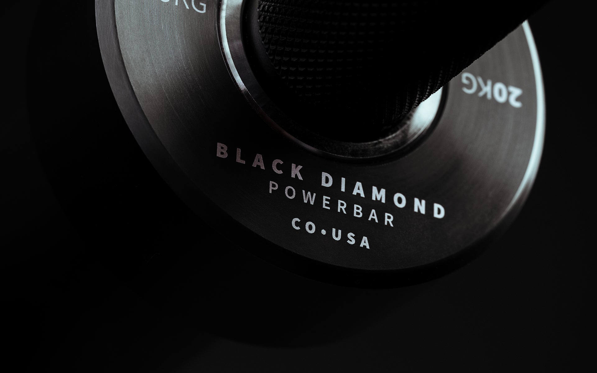 Close-up view of the engraving on the inside part of the collar on a Black Cerakote Black Diamond Power Bar.