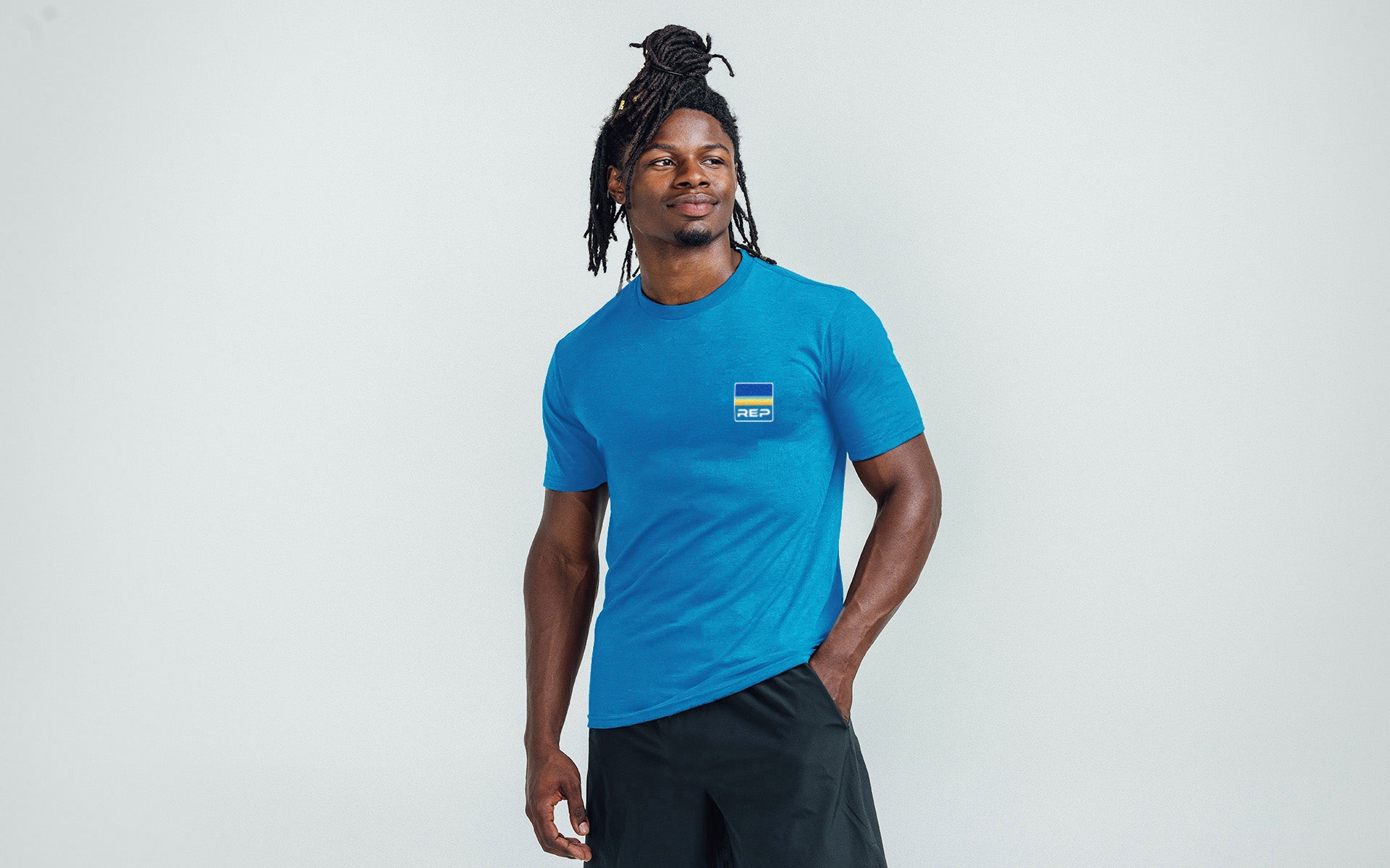 Athlete wearing the REP Fitness Rise Tri-Blend Crew T-Shirt in Heather Royal Blue