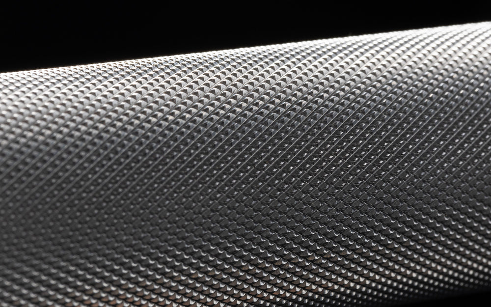 Close-up view of the volcano knurling of the REP 15kg Colorado Bar.