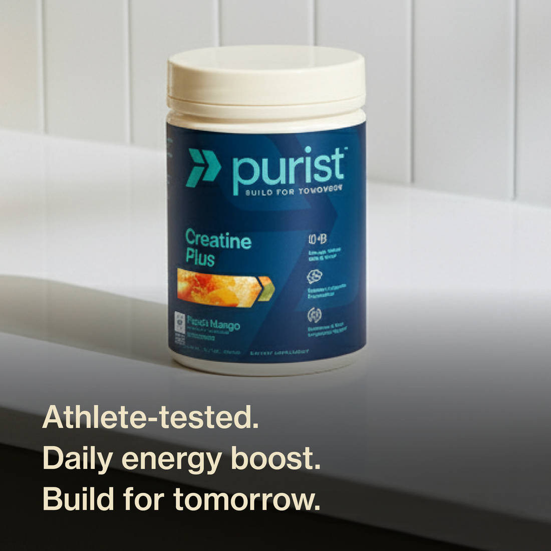 Purist® Creatine Plus container on white counter top with a white back splash. athlete tested. daily energy boost. build for tomorrow.