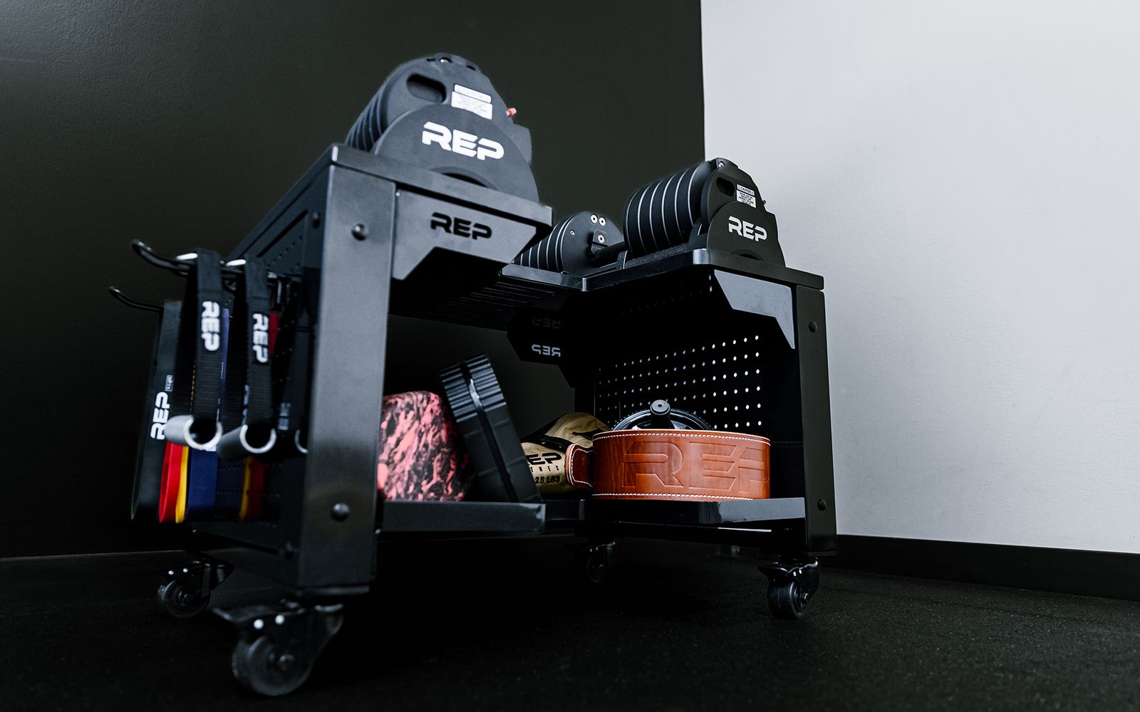 The REP QuickDraw™ Adjustable Dumbbells stored on the REP® Dumbbell Storage Cart.