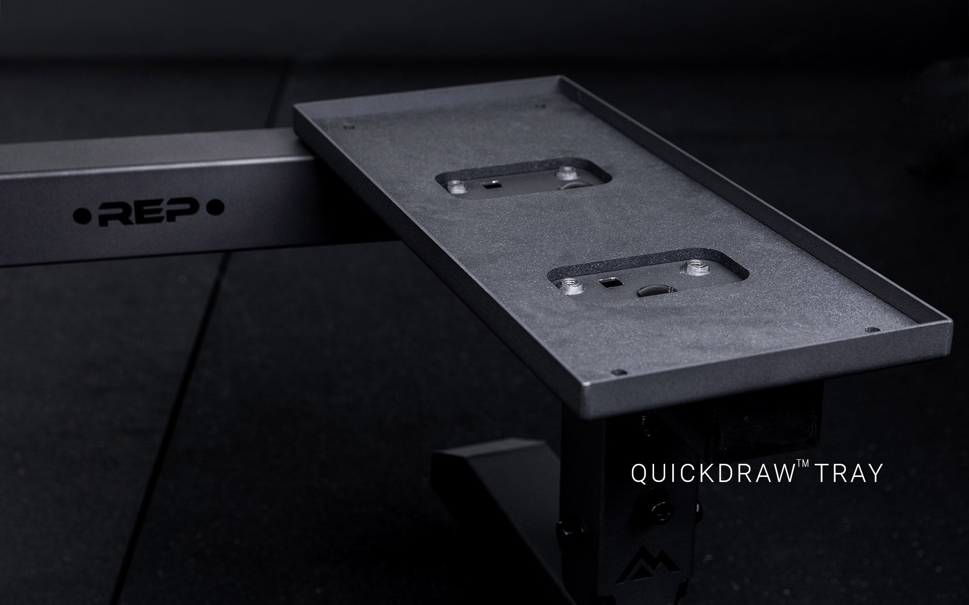 Matte black trays for QuickDraw™ adjustable dumbbells on the REP® Adjustable Dumbbell Stand